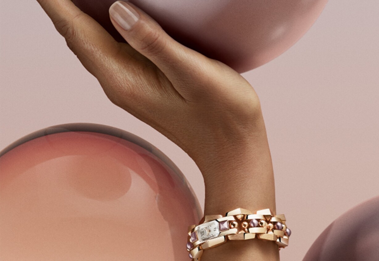 Female hand with a branded watch