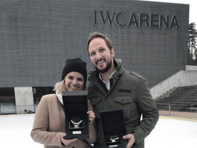 A photo of a woman and a man in front of IWC Schaffhausen building